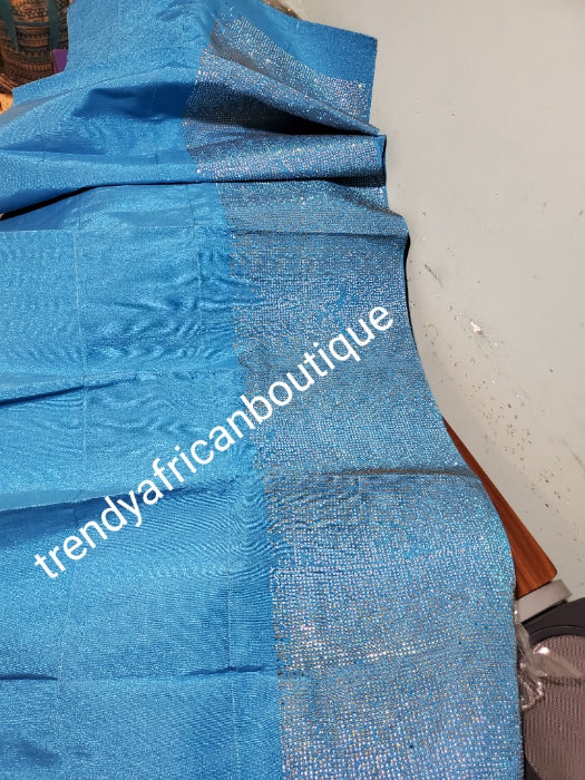 Classic turquoise blue Bedazzled aso-oke. Nigerian woven traditional Aso-oke for making beautiful head wrap. Beaded and Swarovski stones work for perfect headwrap finish. Gele only. Extra wide gele for bigger head wrap. 72" long × 26" wide