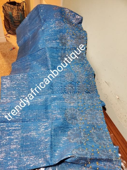 Classic turquoise blue metallic Bedazzled aso-oke. Nigerian woven traditional Aso-oke for making stylish head wrap. Beaded and Swarovski stones work for perfect headwrap finish. Gele only. Extra wide gele for bigger head wrap. 72" long × 26" wide
