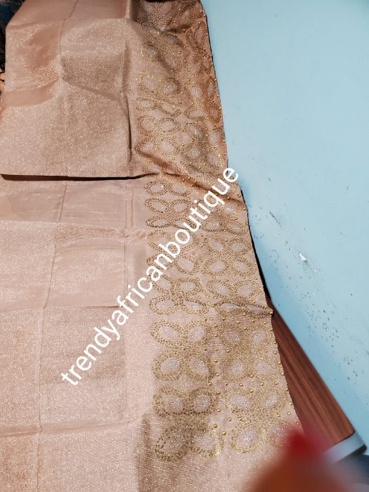 Sweet Rose Gold Bedazzled aso-oke. Nigerian woven traditional Aso-oke for making beautiful head wrap. Beaded and Swarovski stones work for perfect headwrap finish. Gele only. Extra wide gele for bigger head wrap. 72" long × 26" wide