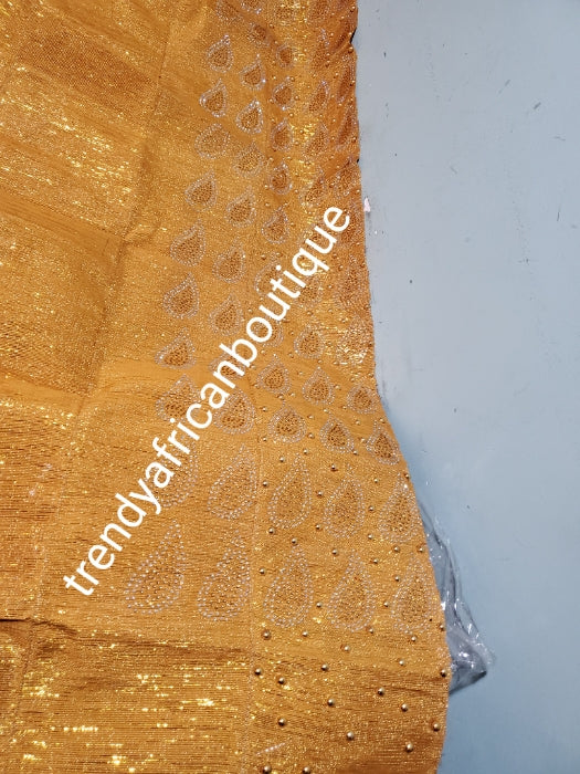 New arrival classic metallic Gold Bedazzled Aso-oke Gele headtie. 26 inch wide for making bigger gele. classic Latest design of Nigerian Traditional aso-oke. Original aso-oke + Stone work. Great texture and easy to make into stylish gele