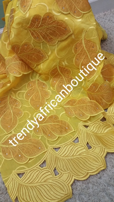 Special Sale: Original Swiss Embriodery Lace fabric embellished with organza leaf petals. classic Bold Border. Great quality and texture for that special occasion. Sold per 5yds. Price is for 5yds