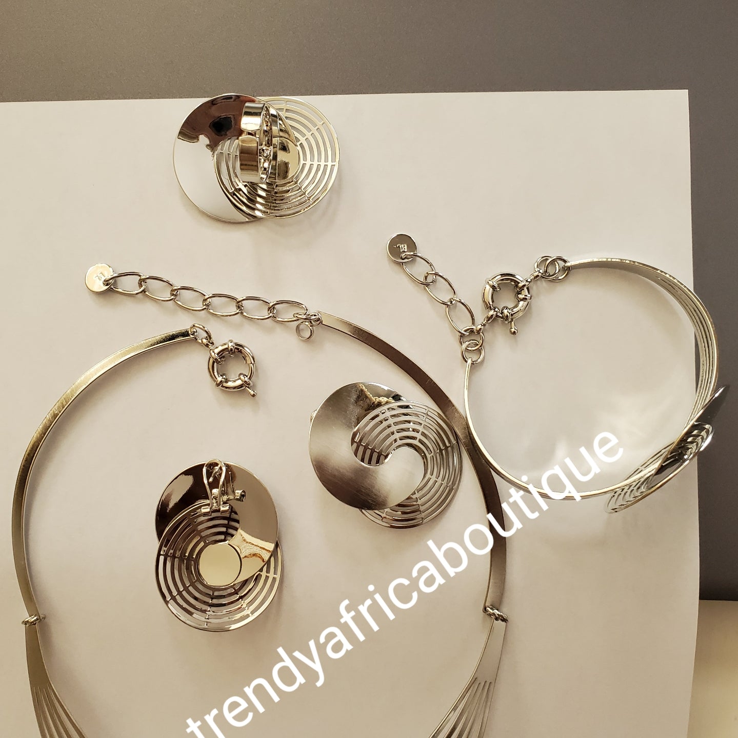 New arrival 4pcs 18k Silver electroplated Dubai Necklace set, earrings, adjustable bangle and ring. Long lasting hypoallergenic plating. Sold as a set