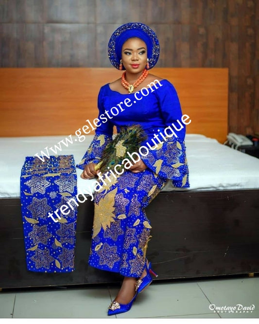 Custom-made Quality Swarovski stones, beaddazzled 4pc Aso-oke set + feather hand fan bonus. Made-to-order Nigerian Traditional wedding Bridal outfit for women. Allow 6-8 weeks for delivery. Can be made in any color of your choice