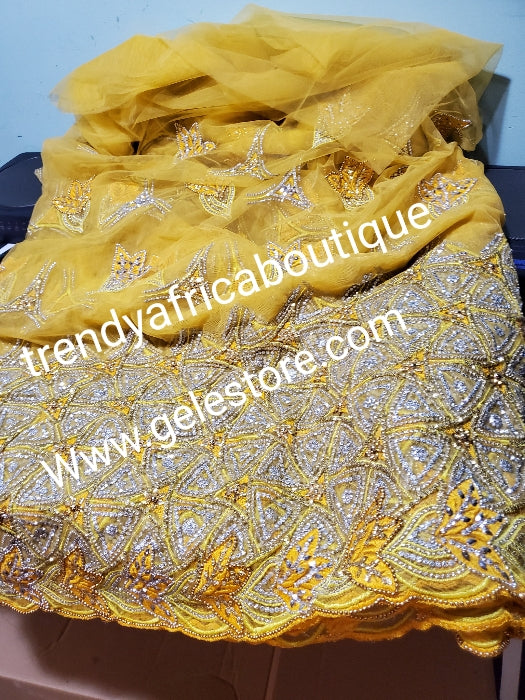 6.5yds. Sweet yellow net George fabric embellished with dazzling Crystals. For that special occasion/igbo Traditional Bridal outfit- net George wrapper/fabric 6.5yds. Use for making red carpet outfit. Model shown use similar fabric