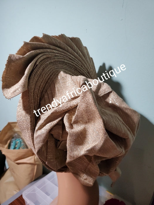 Quality champagne gold Auto-gele made with quality Aso-oke. Beaded and stoned work front and back to perfection. One size fit, easy to adjust for fit and knot at the back to secure your gele. This is true original auto gele