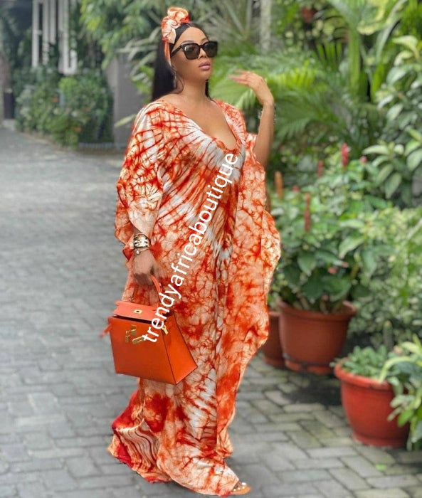 White/Orange silk adire agbada bubu for ladies. Tie and dye or kampala full lenght 60inc long. Grade A quality one size fit up to 1xL