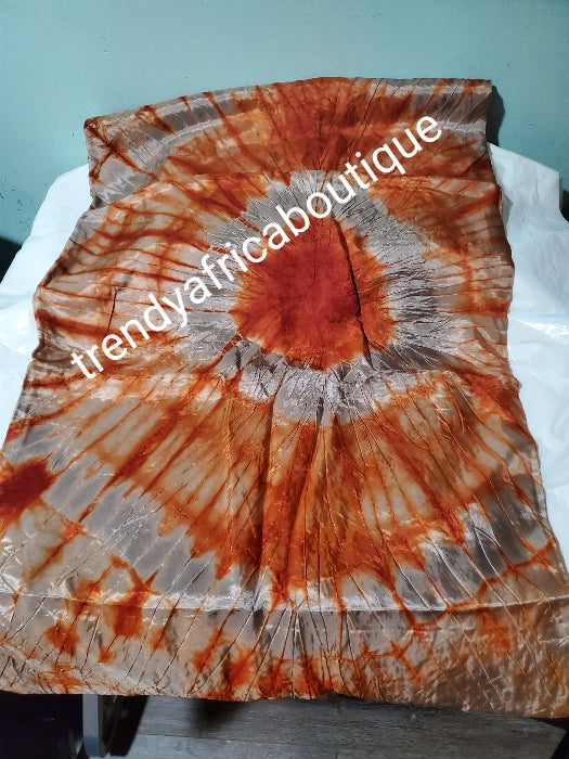 Adire silk fabric. Tie and dye or kampala sold as 4yards a piece. Orange/gray color. Grade A quality