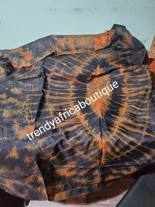 Adire silk fabric. Tie and dye or kampala sold as 4yards a piece. Chocolate/orange color. Grade A quality