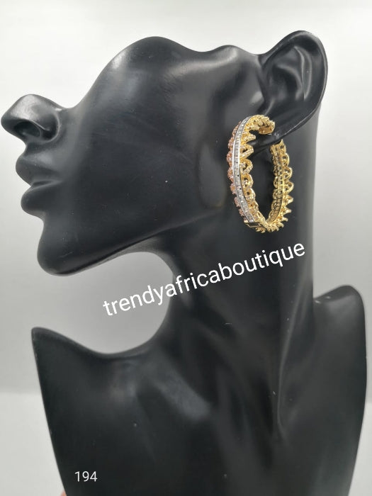 2 tone gold hoop earrings with clear crystal in 18k gold electroplating. Top quality made hypoallergenic. Light weight earrings. Dubai gold earrings