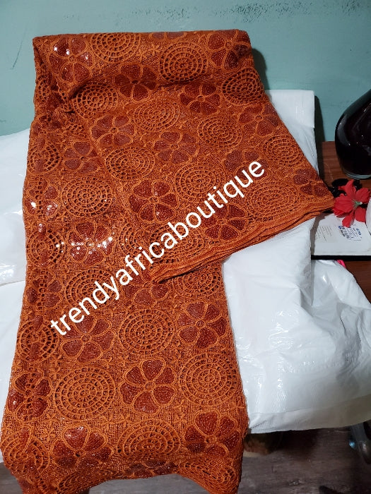 Sale: Burnt Orange Lustrous quality Africa french lace fabric embellished with sequence. Soft texture sold per 5 yards