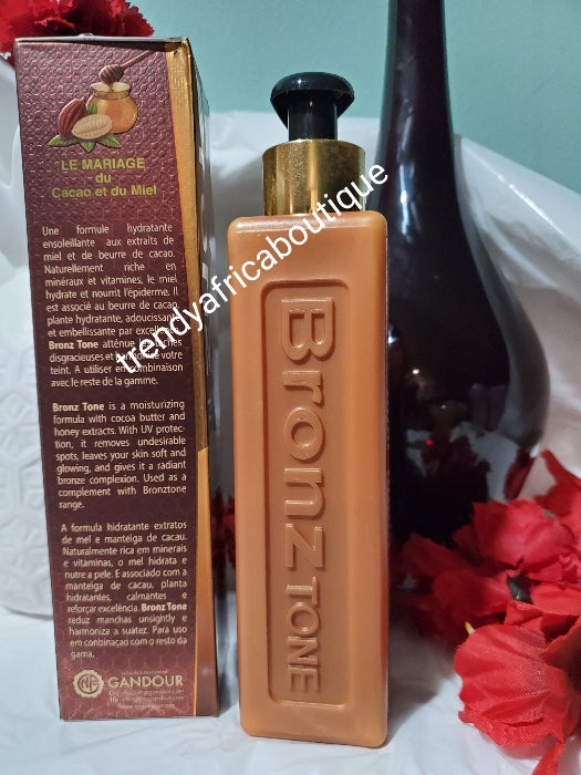 Bronze tone Maxiton fade milk formulated with cocoa butter and honey extracts for brown/caramel skin. 300ml bottle. Moisturizing body lotion and fades out spots