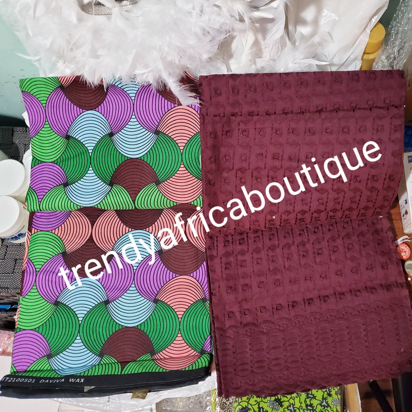 African wax print- Ankara + plum lace combination pack. 3yard ankara and 2 yards dry lace in a pack. Luxuriouse quality ankara. Veritable wax print