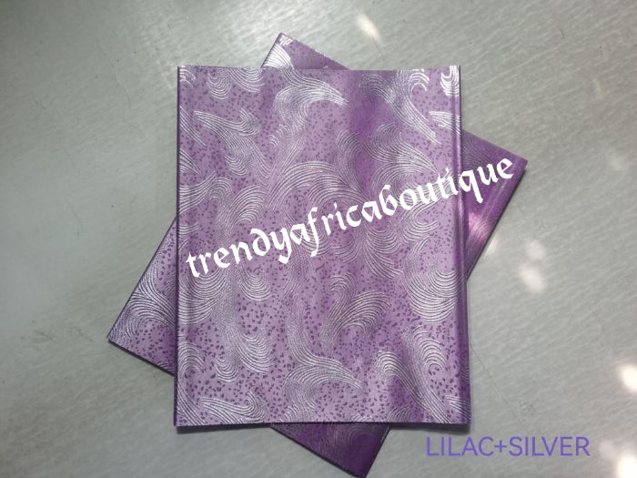 Lilac/silver 2 in 1 pack Sago gele head tie for Nigerian head wrap. Beautiful design. Soft texture, easy to tie into beautiful Nigerian party gele. Excellent quality. Sold as a park