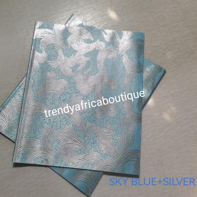 Skyblue/silver 2 in 1 pack Sago gele head tie for Nigerian head wrap. Beautiful design. Soft texture, easy to tie into beautiful Nigerian party gele. Excellent quality. Sold as a park