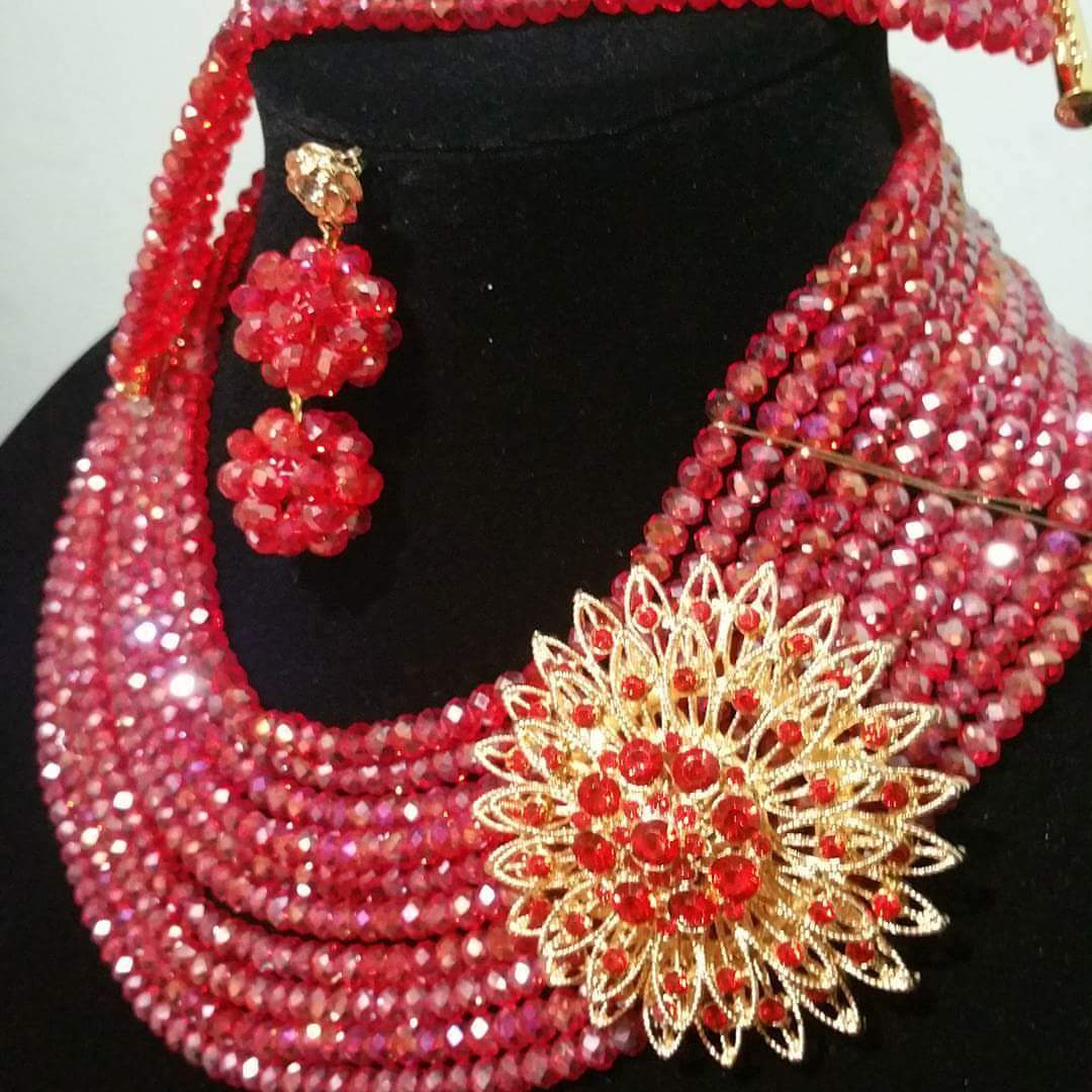 Sale: Red Crystal beaded necklace set in choker. 10 rows beaded necklace with side broach. Coral-necklace