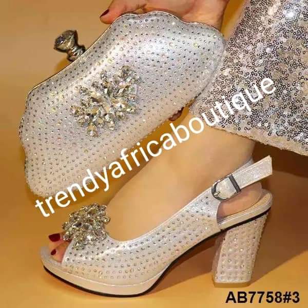 Available in Size 42 Silver Italian style matching platform shoe and hand clutch. Embellish with Quality crystal stones on shoe and clutch. Italian made shoe and bag. Sold as a set. Note shoe run big in size. Heel is 3.5"