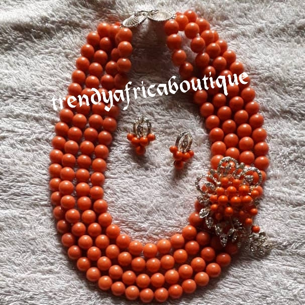 4 layers peach beaded-necklace with a side broach, matching earrings and bracelet. Traditional Bridal wedding bead. Exclusive Nigeria native bead design with gold accessories sold per set. Bridal-accessories