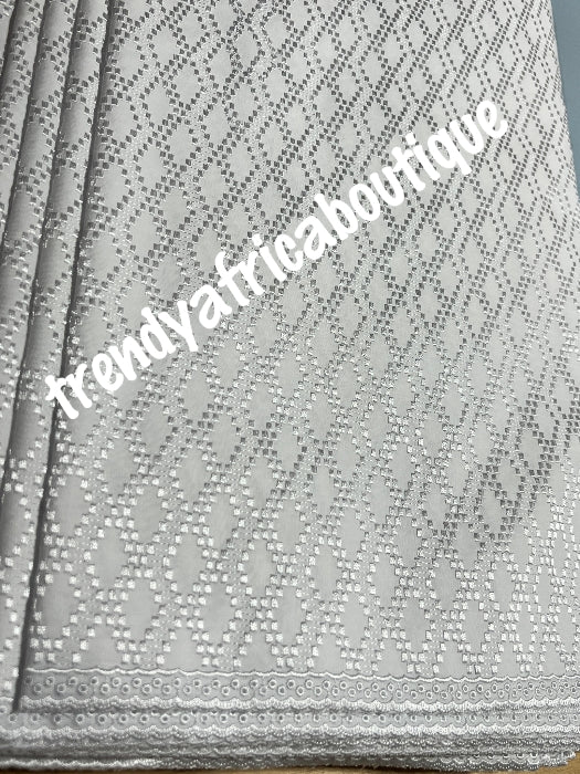 New arrival luxurious White cotton swiss lace fabric for men.  Nigerian native traditional outfit. Soft quality fabric. Can be use for agbada/3pc outfit for men. Sold per 5yds. Price is for 5yds.