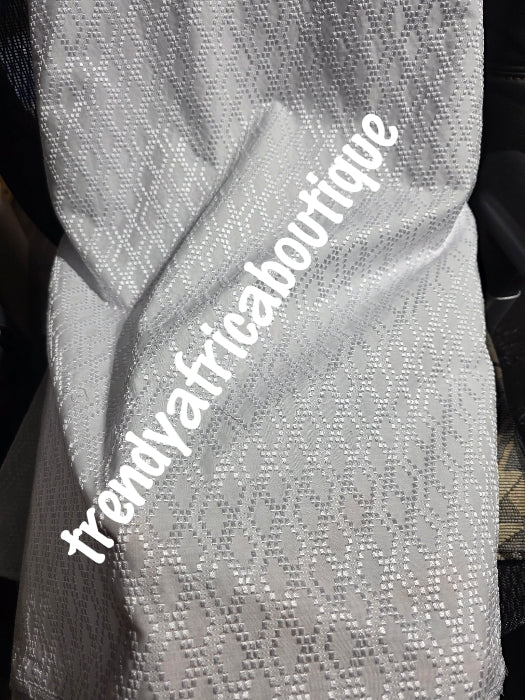 New arrival luxurious White cotton swiss lace fabric for men.  Nigerian native traditional outfit. Soft quality fabric. Can be use for agbada/3pc outfit for men. Sold per 5yds. Price is for 5yds.