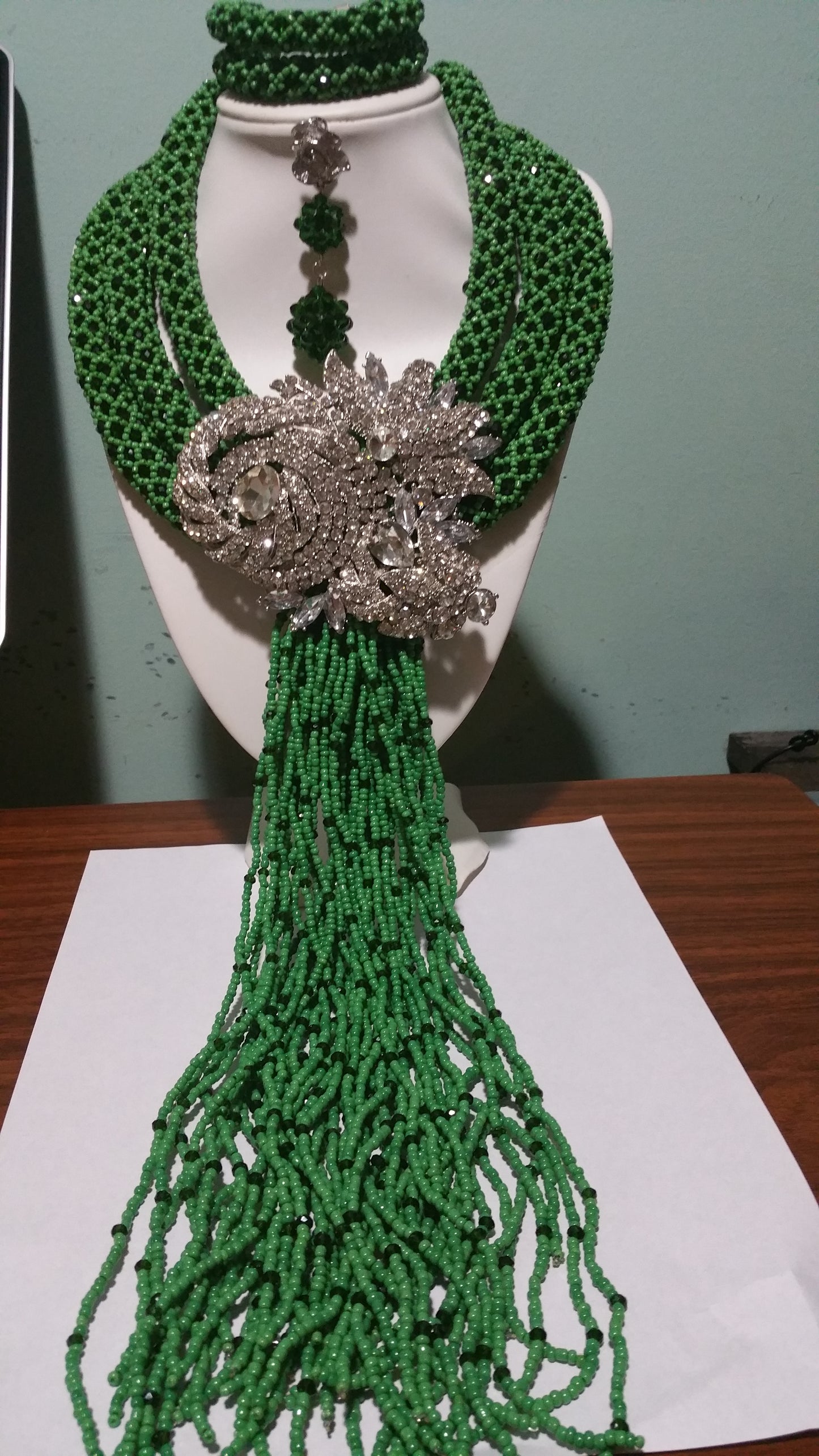 Clearance: Elegant 3 row Green beaded Necklace set. Bold silver broach & multi strings droppings. Coral-necklace set for Nigerian women