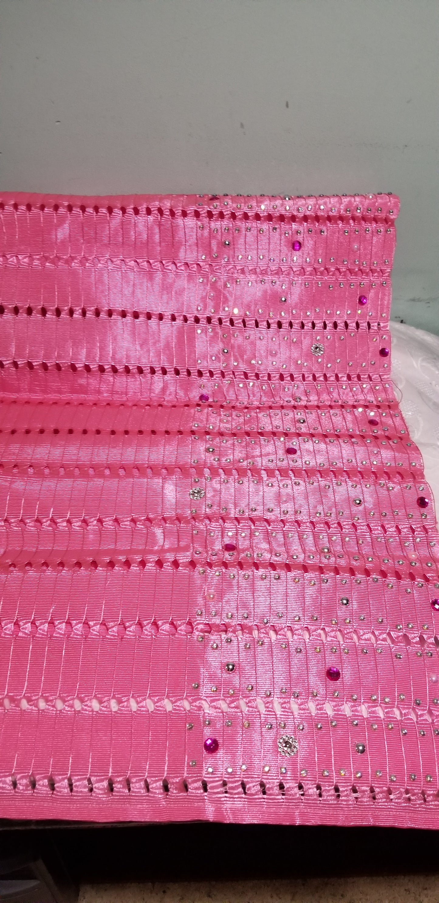 Quality Pink Nigerian aso-oke for making Gele. Latest design beaded and stoned border for making Nigerian party Gele. Sold as one piece in a bag for gele