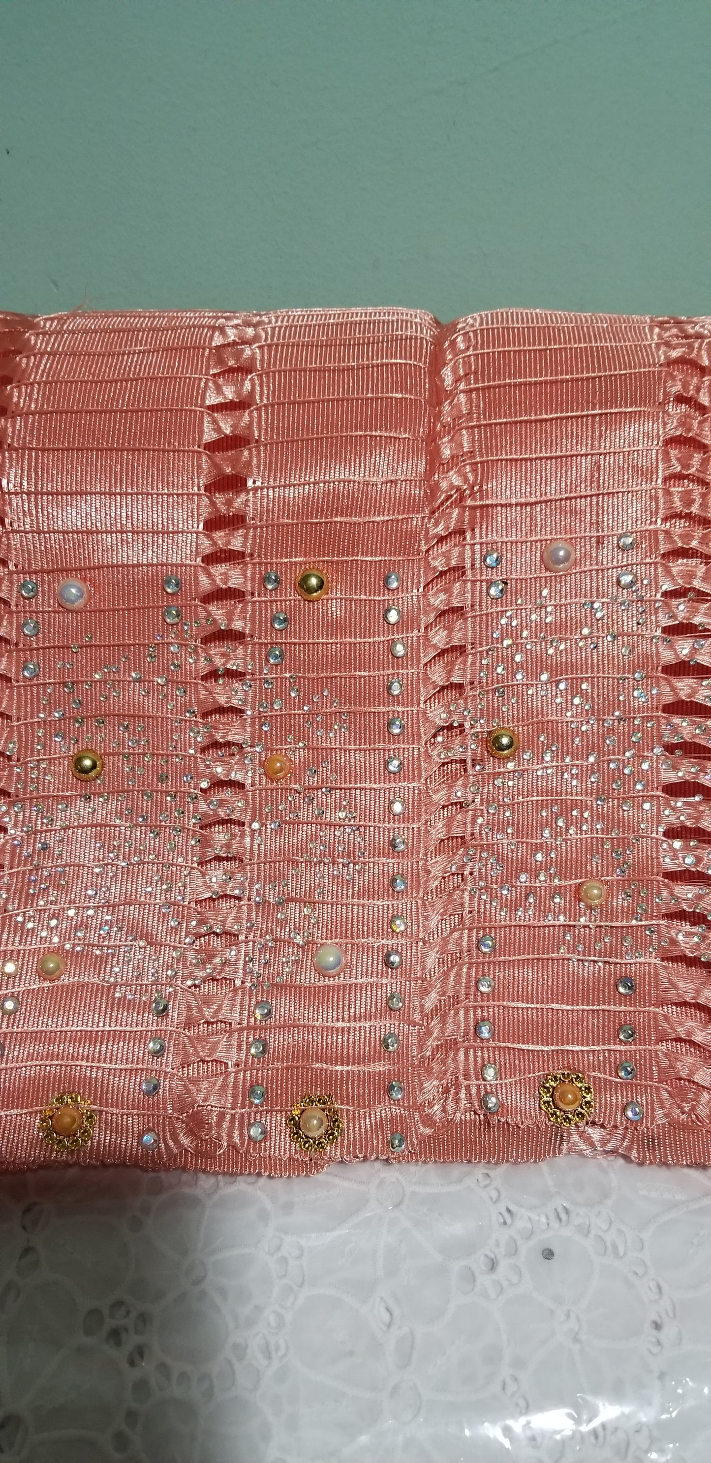 Latest Peach color Aso-oke Gele only. Bead dazzled and stones border. Holes and stones woven from Nigeria. Original quality