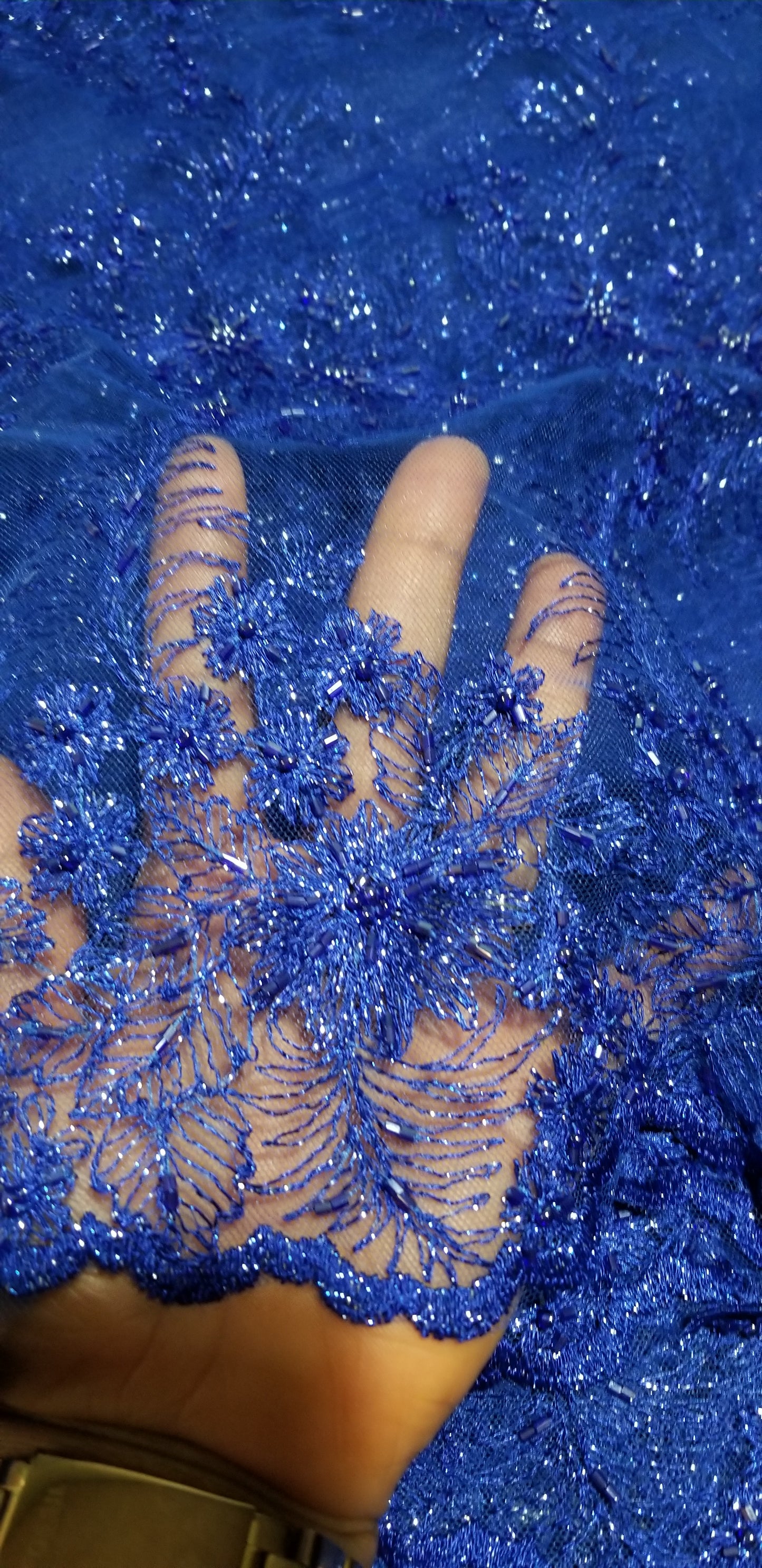 Assorted colors net beaded and stoned fabric for making Blouses for skirt or wrapper.  sold per-yard  36" by 50" wide. Available in royal blue, silver orange and turquoise blue