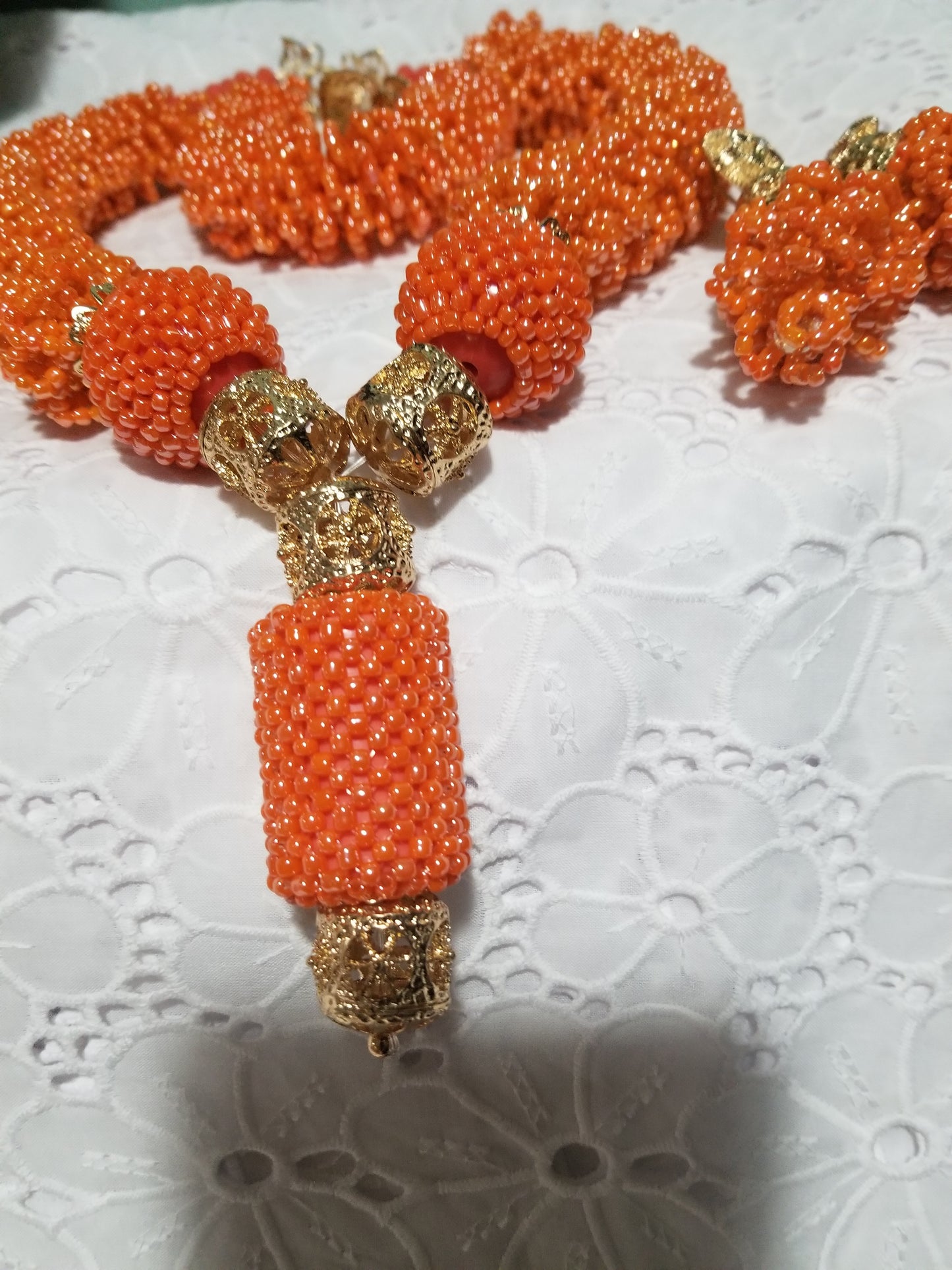 Original Coral-necklace set. Small coral beads in cluster necklace for Nigerian traditional use. Sold with matching bracelet and earrings. Bracelet fit 7-8" wrist