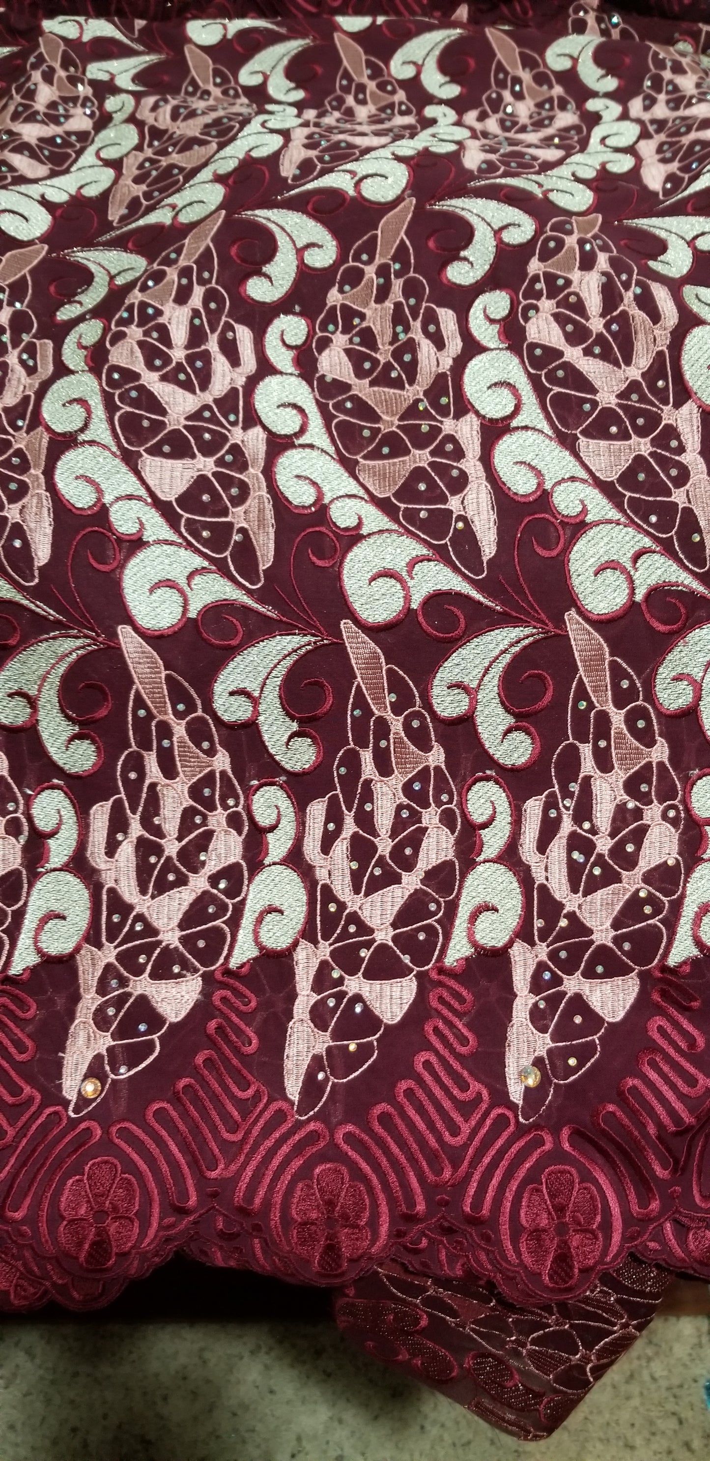 Maroon Swiss lace Fabric. Quality embroidery, all over crystal stones. Sold per 5 yards, peice is for 5yds. Nigerian celebrants Swiss lace at a discount price