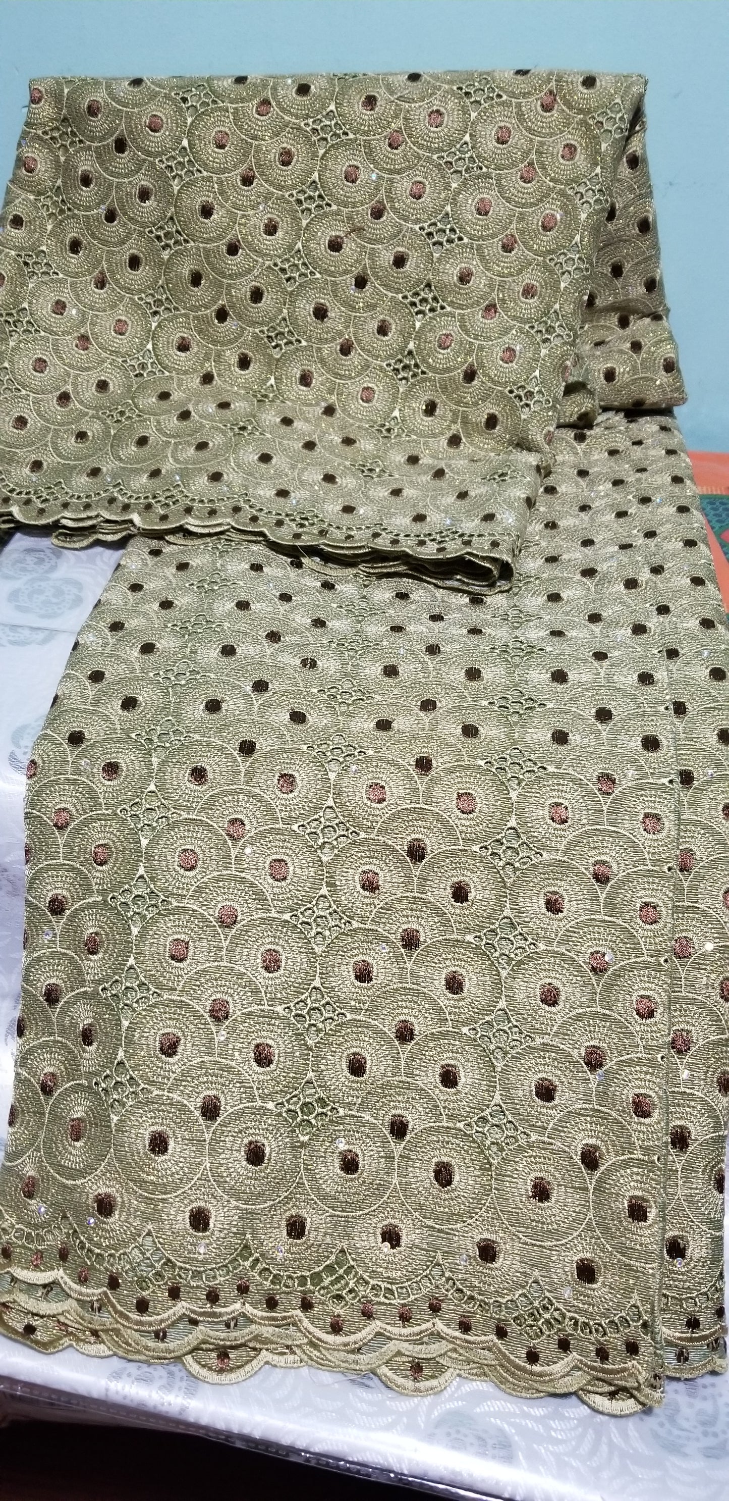 Classic Olive green swiss lace fabric. Embellish with gold lurex and crystal stones. Soft quality swiss lace sold in 5yds, price is for 5yds. Ideal color for men or women Nigerian traditional outfit
