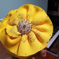 Yellow color Women-turban. One size fit all turban. Beautiful flower design with a side brooch to add decor to your head wrap accessories. Head wrap made ready