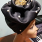 Black color Women-turban. One size fit all turban. Beautiful flower design with a side brooch to add decor to your head wrap accessories. Head wrap made ready