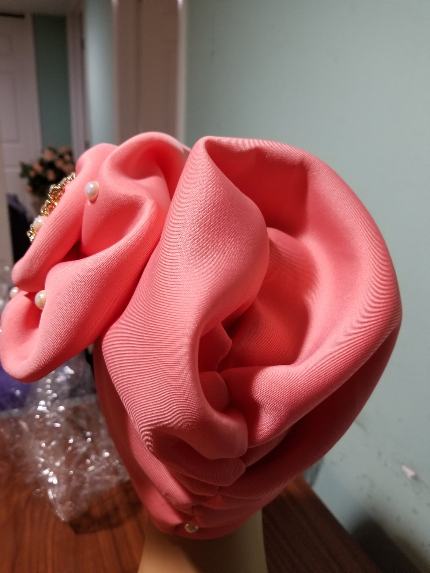 Coral color Women-turban. One size fit all turban. Beautiful flower design with a side brooch to add decor to your head wrap accessories. Head wrap made ready