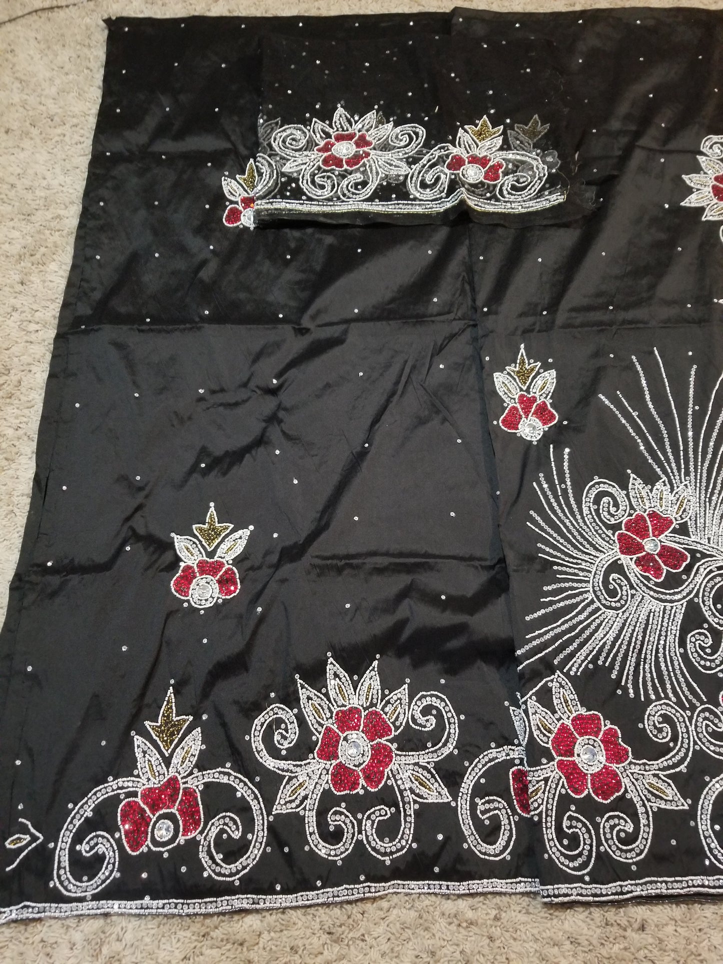 Special offer Nigerian Traditional wedding hand stoned silk George Wrapper and matching net blouse. Black with silver/red/gold crystal stones.  Beaded and stoned on the side border as well