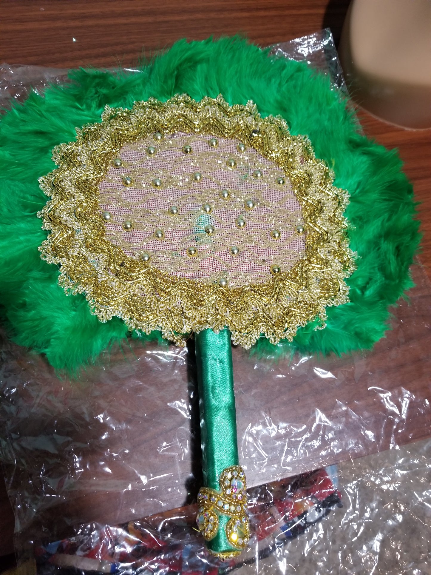 New arrival Green bead-dazzled feather hand fan. Nigerian Bridal accessories Feather hand fan. Long handle beaded and stoned. Size: Small feather in Green color