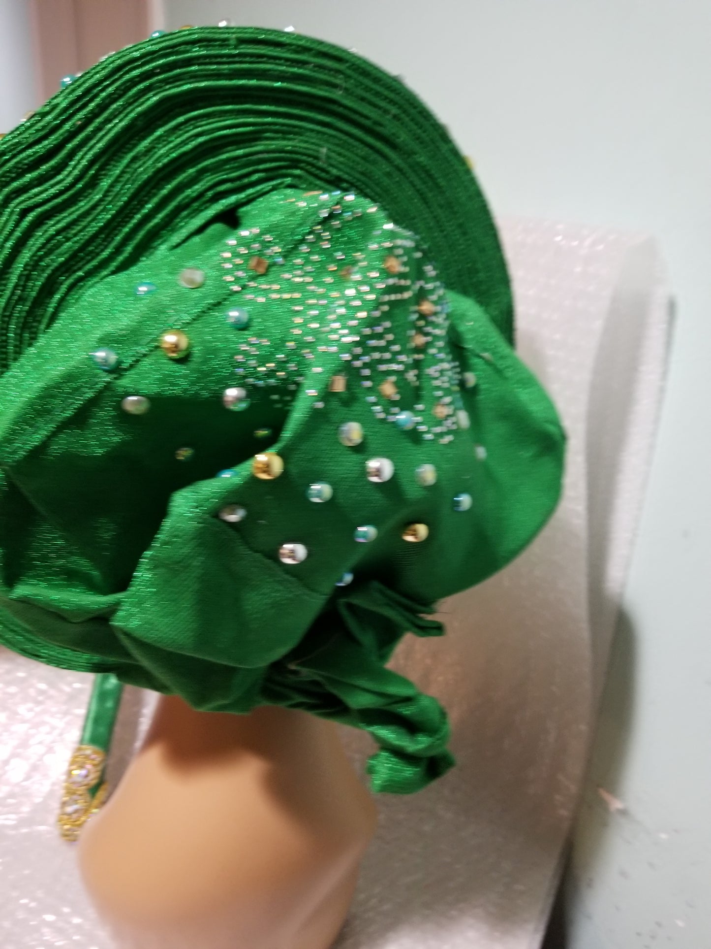 Clearance: Ready to ship Nigerian Green auto-gele. Wahala free gele all ready made for you with quality aso-oke from mother land. Embellished with beads and stones.