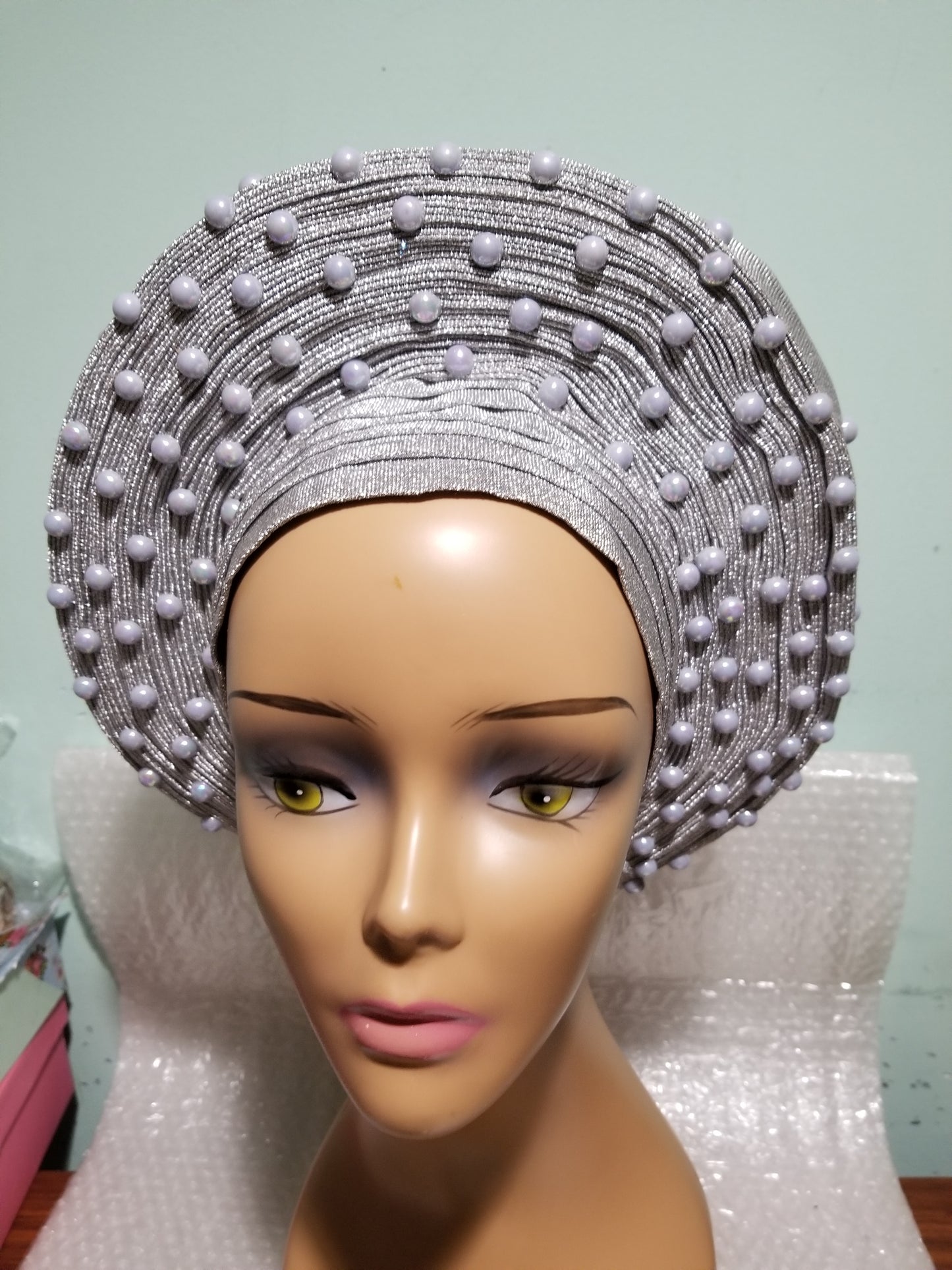 New arrival:  Nigeria auto-gele in Silver. Made with quality aso-oke/woven in Nigeria. made into gele. beaded and stoned. Party ready in less than 5 minutes. One size fit, easy adjustment at the back