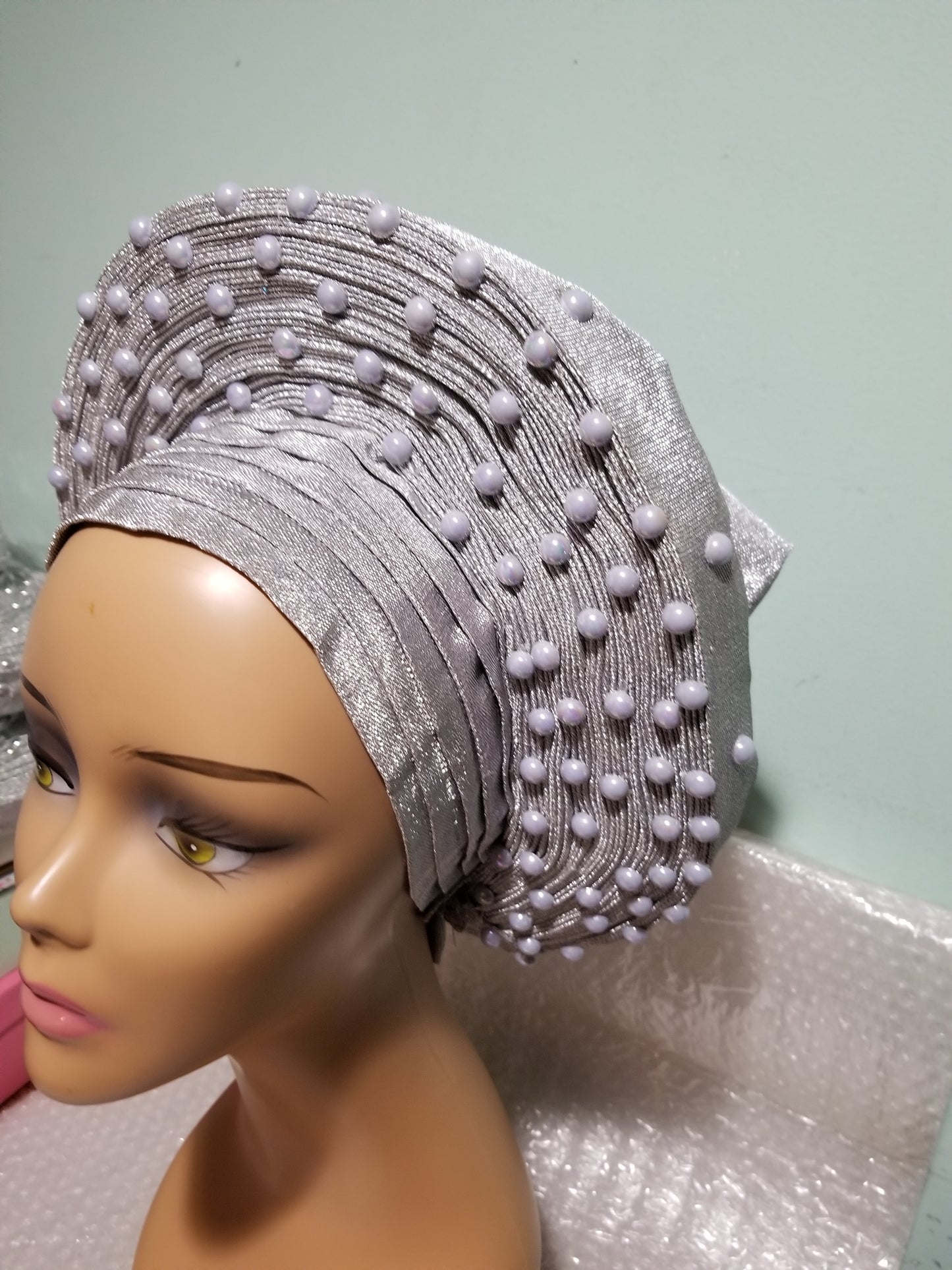 New arrival:  Nigeria auto-gele in Silver. Made with quality aso-oke/woven in Nigeria. made into gele. beaded and stoned. Party ready in less than 5 minutes. One size fit, easy adjustment at the back