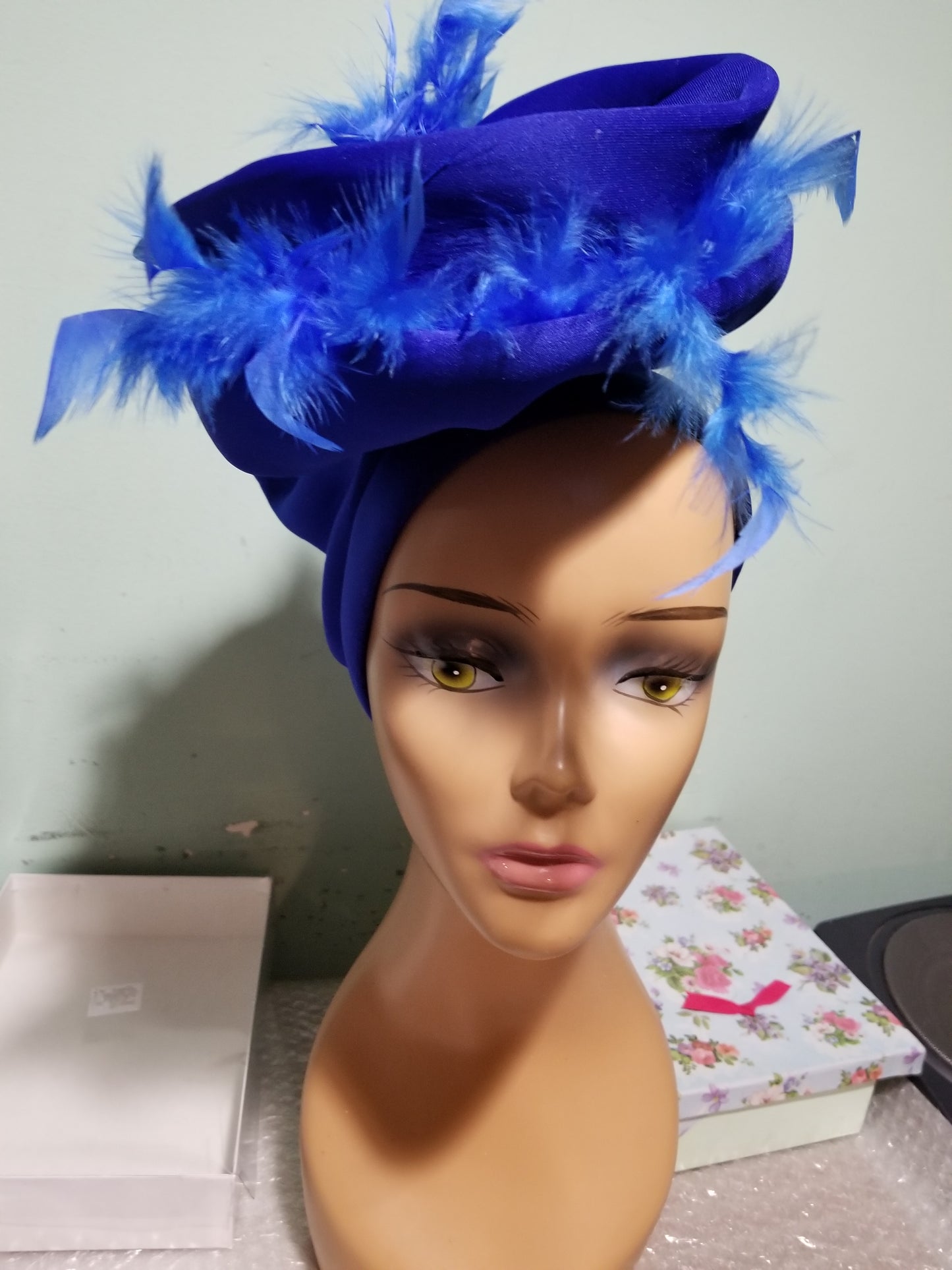 Royal blue color Women-turban. One size fit all turban. Beautiful feather design with a side brooch to add decor to your turban