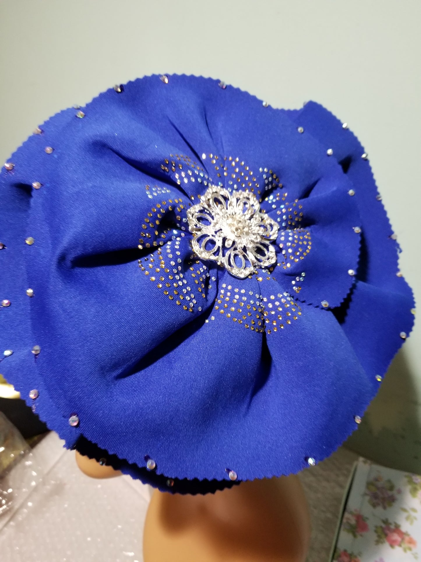Royal blue color Women-turban. One size fit all turban. Beautiful flower design with a side brooch/ embellished with crystal stones to add decor to your turban