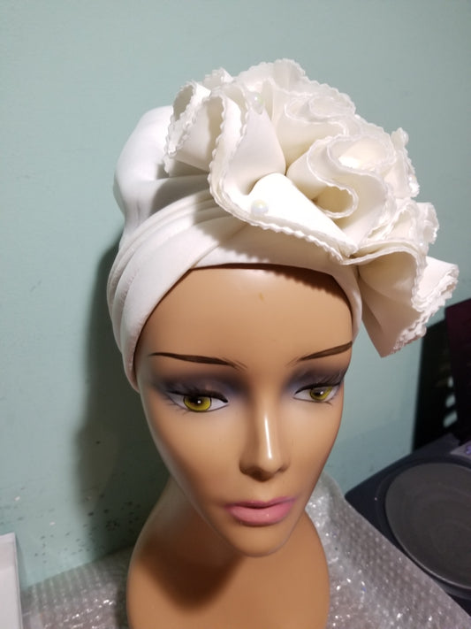 Off white color Women-turban. One size fit all turban. Beautiful rose flower design with a side brooch to add decor to your turban