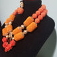 Clearance: back in stock orange beaded coral-necklace set in 2 rows. Orange pendant for a beautiful look. Sold as a set