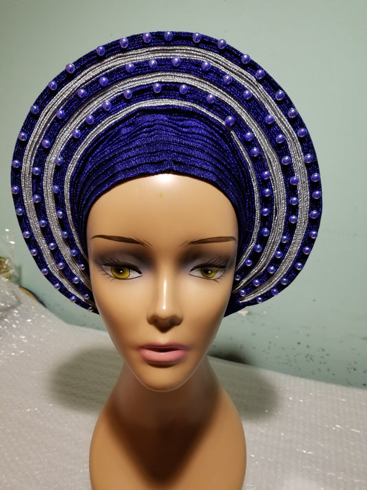 Royal blue/silver embellished with beads auto-gele. Wahala free gele aleeady made for you. One piece with adjustment for proper fit at the back. Original quality from Nigeria.