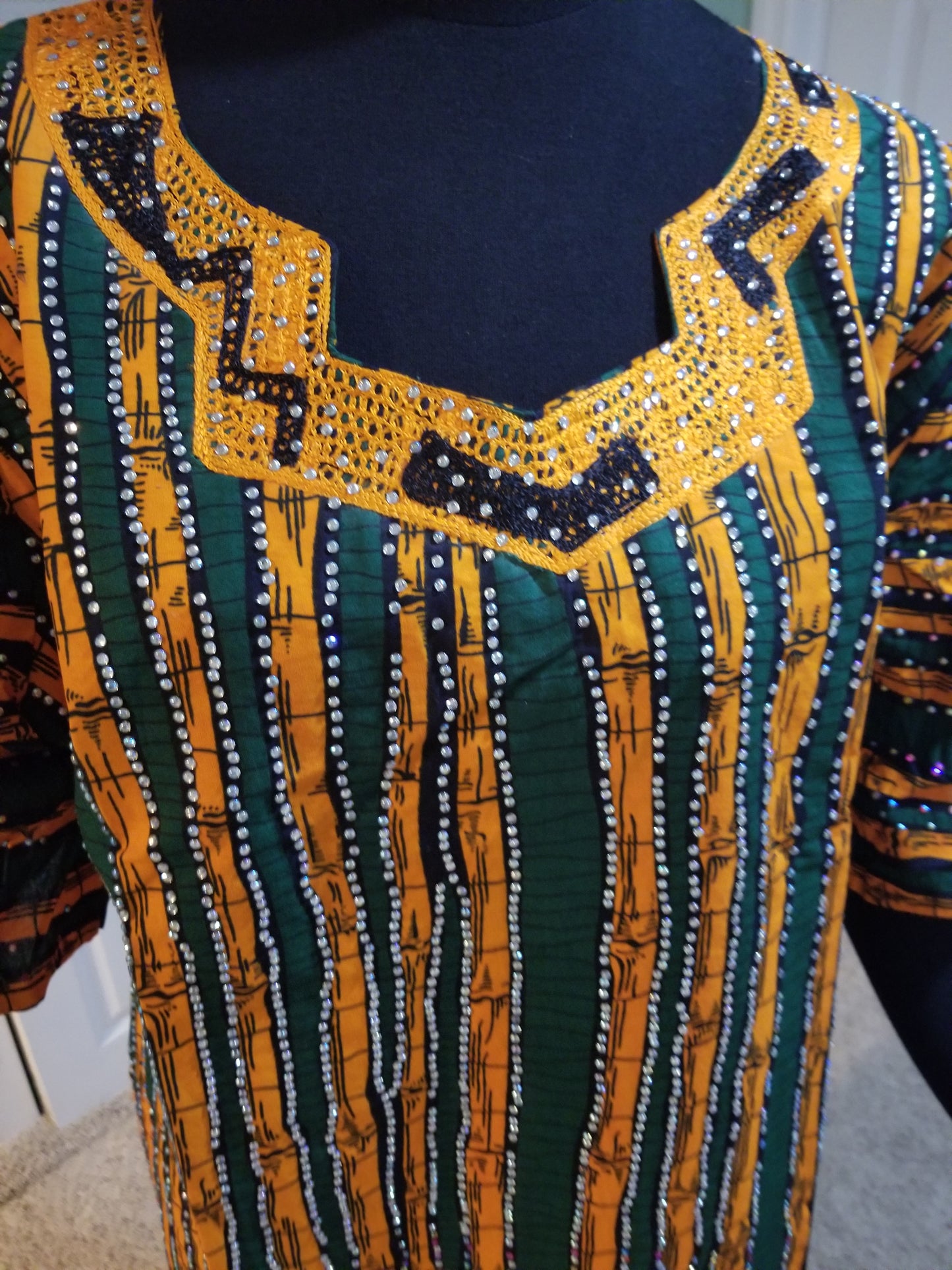 Sale sale: green/orange embroidered Ankara-dress, embellished with shinning Swarovski stones to perfection! Fit Burst 48" and 60" lenght shoulder to floor. Made with Quality hitarget Ankara. Comes with a matching headtie.