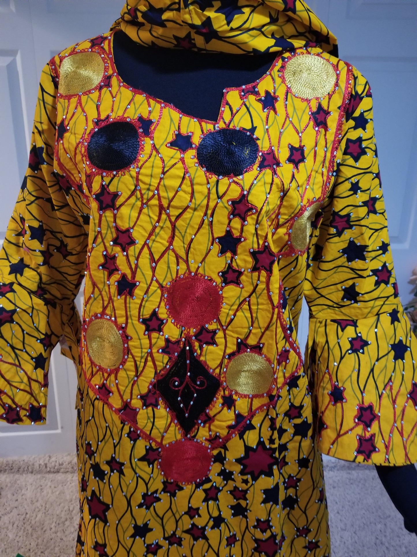 Sale sale: embriodered and stoned yellow star Ankara-dress, embellished with shinning Swarovski stones to perfection! Fit Burst 52" and 57" lenght shoulder to floor. Made with Quality hitarget Ankara. Comes with a matching headtie. Flared sleeves