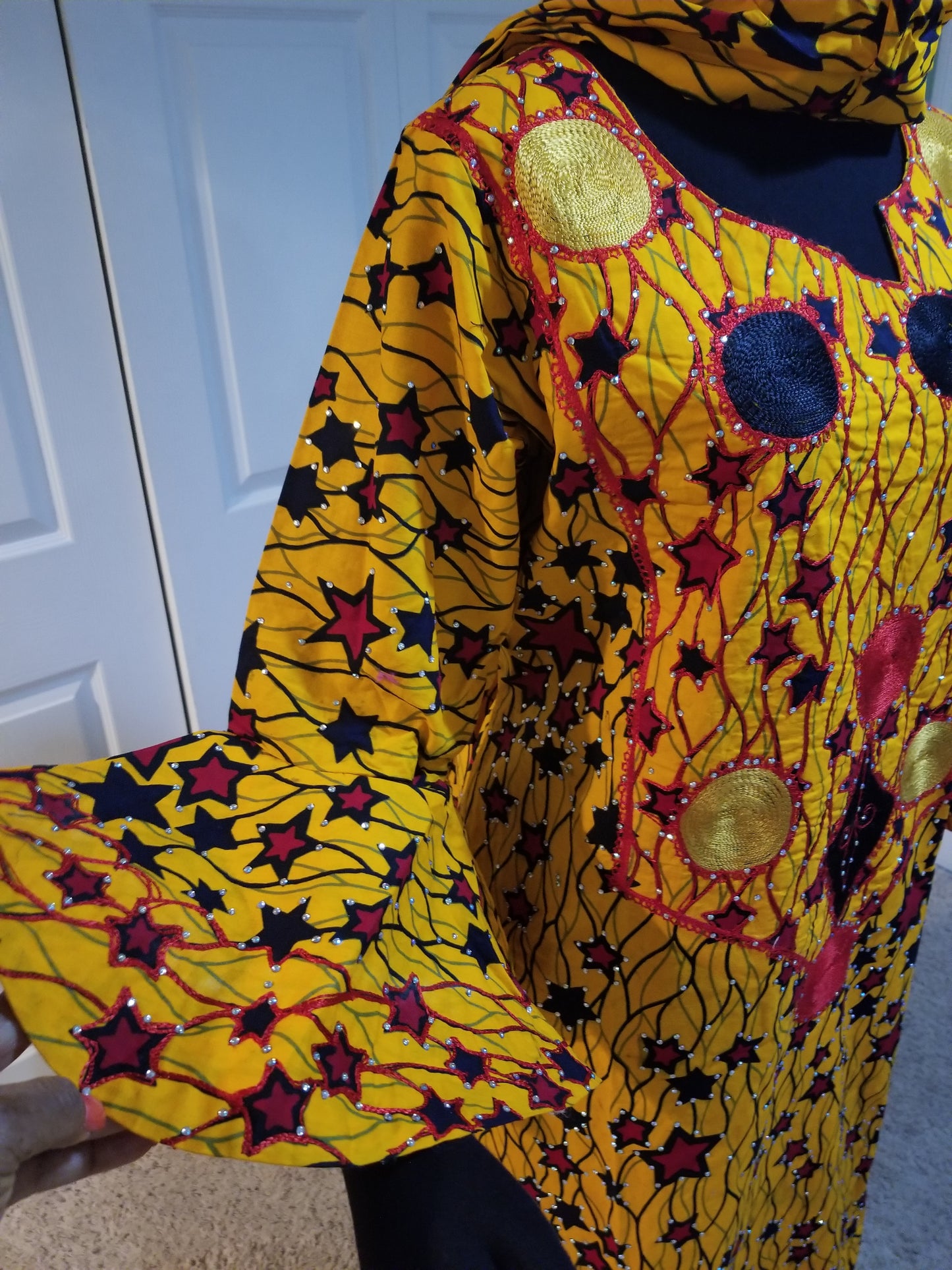 Sale sale: embriodered and stoned yellow star Ankara-dress, embellished with shinning Swarovski stones to perfection! Fit Burst 52" and 57" lenght shoulder to floor. Made with Quality hitarget Ankara. Comes with a matching headtie. Flared sleeves