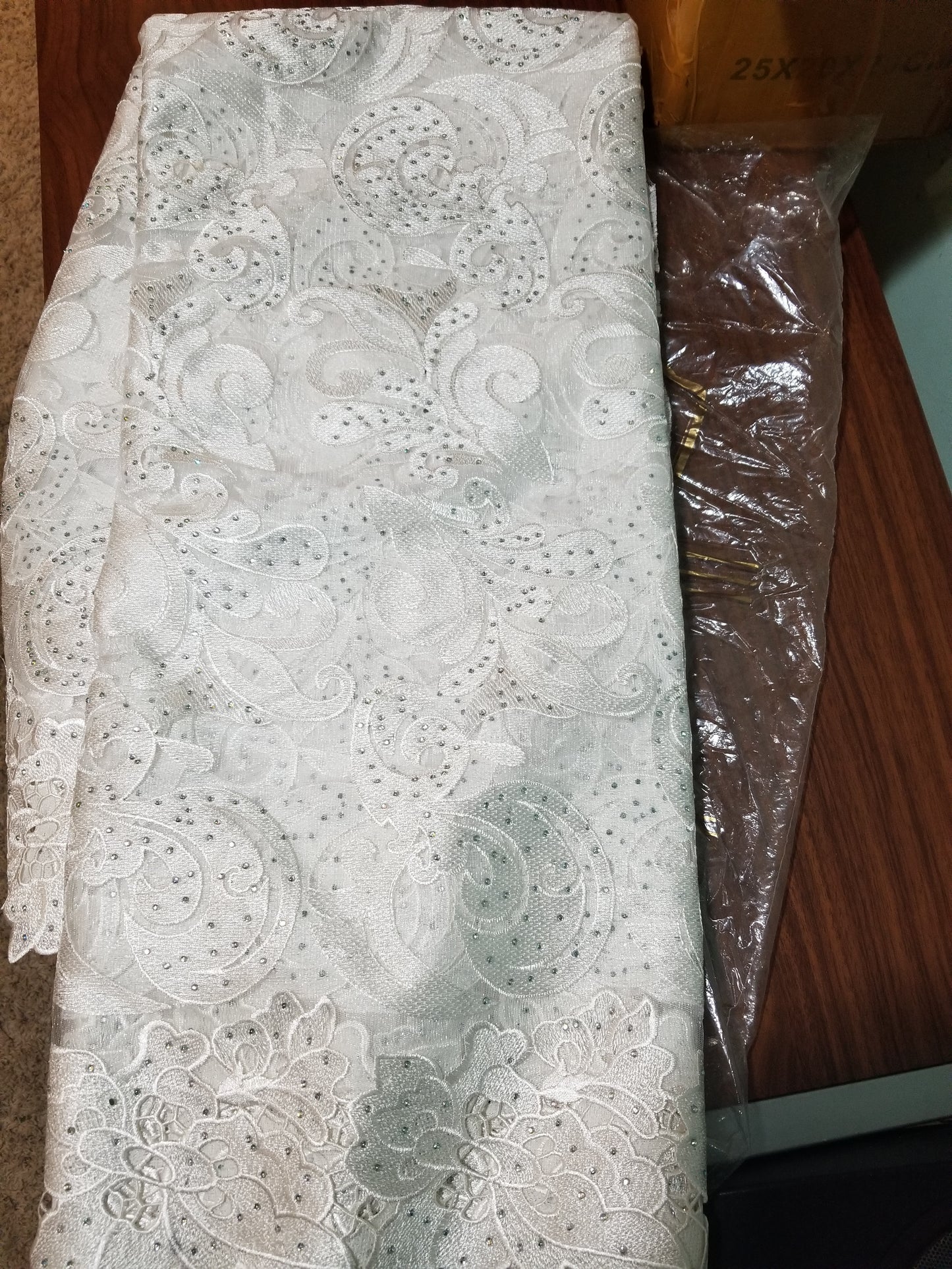 CLEARANCE ITEM: white French lace fabric with silver lurex and all over crystal stone work. Sold 5yards length