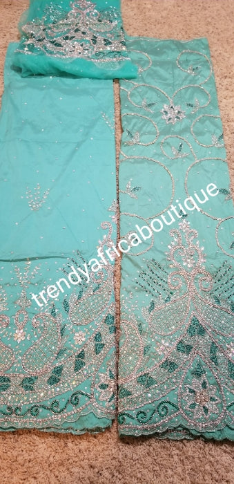 New arrival VIP/Celebrant Silk George wrapper in Mint green. All hand stoned . 5yds and 1.8yds matching net blouse for that special Occasion. Nigerian Traditional Igbo wedding wrapper