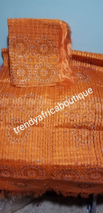 Nigerian Celebrant beaddazzled Aso-oke set in beautiful Orange. Sold as 2pcs set original quality design.  aso-oke for gele/Ipele (shoulder shawl). Extra wide Gele /Ipele. Sold as a set.
