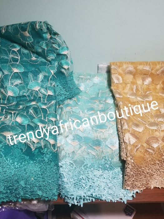 Beautiful Gold French lace fabric.  Model show wearimg mint green. Sold per 5yds, price is for 5yds. African french lace fabric with guipure lace border